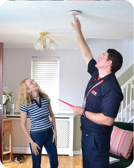 Home safety inspection conducted by technician with resident.