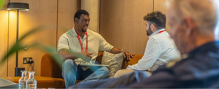 Two staff discussing in one room